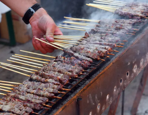 stock image many meat skewers called ARROSTICINI cooked on embers typical of the cuisine of Southern Central Italy in the Abbruzzo and Molise regions