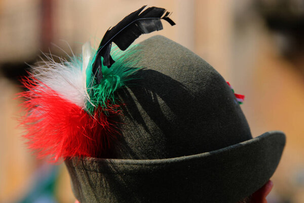 Black Feather Hat typical of the uniform of the Alpini the mountain troops of the Italian Army and with a tricolor decoration with the colors of Italian flag