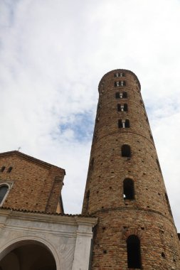 Ravenna, RA, Italy - April 27, 2024: high bell tower foi Church of Saint Apollinare Nuovo without people clipart