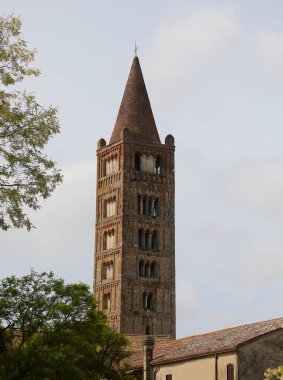 Codigoro, FE, Italy - April 28, 2024: High bell tower of Pomposa Abbey an old Benedictine monastery clipart