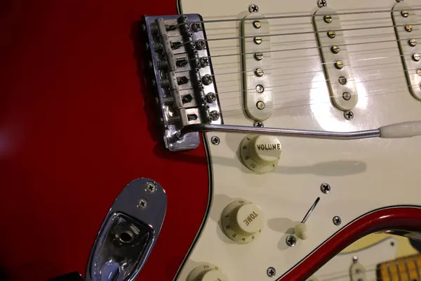 Stock image Detail of electric guitar with lever  that is used to create the vibrato effect called a tremolo arm and volume tone knob