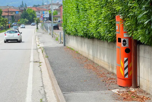 stock image hidden roadside speed detection device called AUTOVELOX in Italian Language captures images of speeding drivers exceeding the legal limit