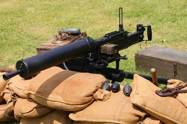 stock image sandbags in the trench and the very old machine gun used during the world wars