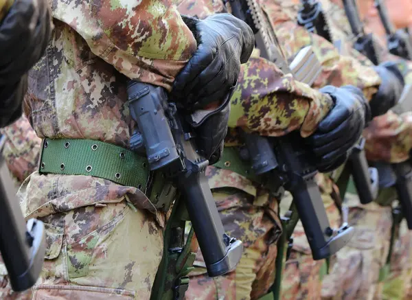 stock image platoon of army soldiers in camouflage uniform and assault rifle during parade