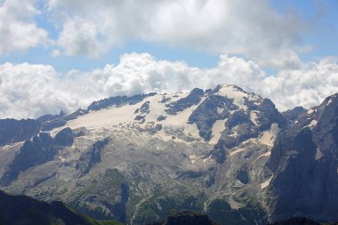 view of Marmolada glacier over 3000 meters high is melting due to rising temperatures caused by climate change clipart