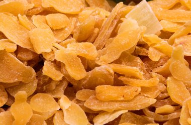 background of small pieces of Dehydrated ginger for sale in the stall of the ethnic market clipart