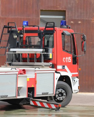 Vicenza, VI, Italy - May 23, 2024:  red fire truck in italy has the number 115 for emergency calls in case of fires or other urgent situations clipart