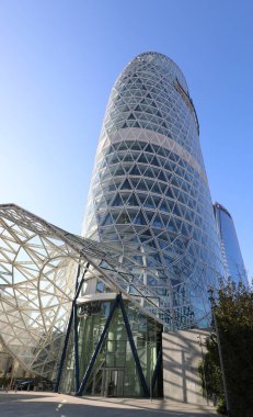 Milan, MI, Italy - November 2, 2024: ultra-modern skyscraper which is the headquarters of the insurance company UNIPOL with glass windows and metal frame 125 metres tall clipart