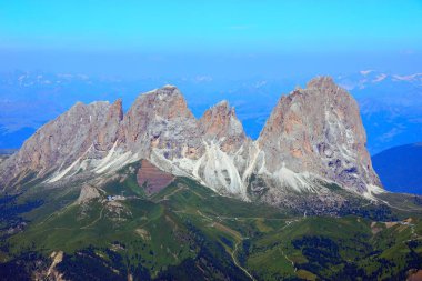 panoramic view of the sassolungo mountain group from mount marmolada on a beautiful summer day clipart