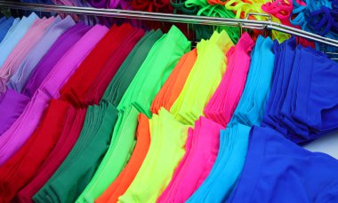 variety of brightly colored panties and briefs are for sale at the intimate apparel market stall clipart