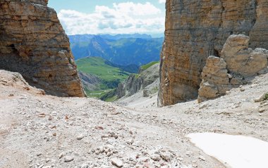 Very steep scree slope descending from the mountain to the valley bottom in the European Alps in northern Italy clipart