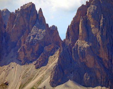 Alpine hut called rifugio toni demetz between two high mountains in Northeern Italy in the Europeans Alps clipart