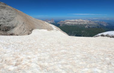 Pink snow caused by desert sand carried by the wind to the top of Mount Marmolada, over 3000 meters above sea level. clipart