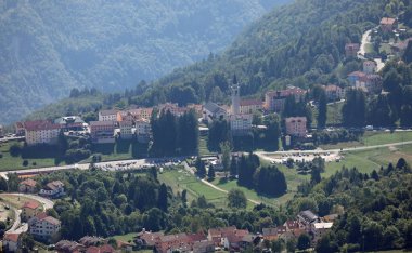 aerial view of the small mountain village named tonezza del cimone in northern italy during summer clipart