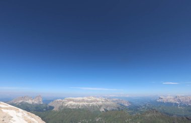 Panoramic view of Mountains called SASS PORDOI from Marmolada Mount on European Alps in Northern Italy in summer clipart