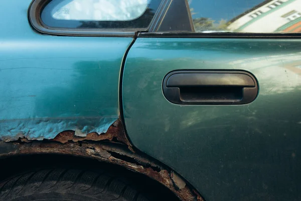 rust on the car near the tire. High quality photo