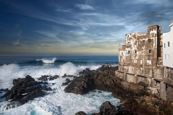 stock image Old weathered buildings on ocean coastline, Porto de la Cruz - Punta Brava, Tenerife, Spain