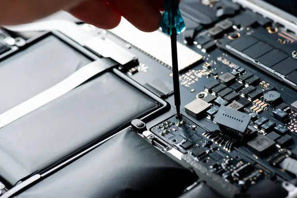 stock image close up of Technician repairing electronic circuit board, repairing deteriorated battery, upgrade and technology.