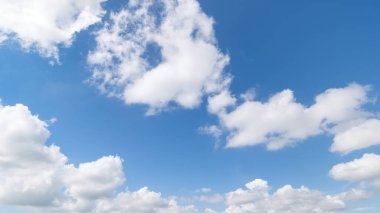 Panoramic view of clear blue sky and clouds, Blue sky background with tiny clouds. White fluffy clouds in the blue sky.