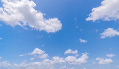 Panoramic view of clear blue sky and clouds, Blue sky background with tiny clouds. White fluffy clouds in the blue sky.