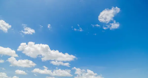 stock image clear blue sky background,clouds with background, Blue sky background with tiny clouds. White fluffy clouds in the blue sky. 