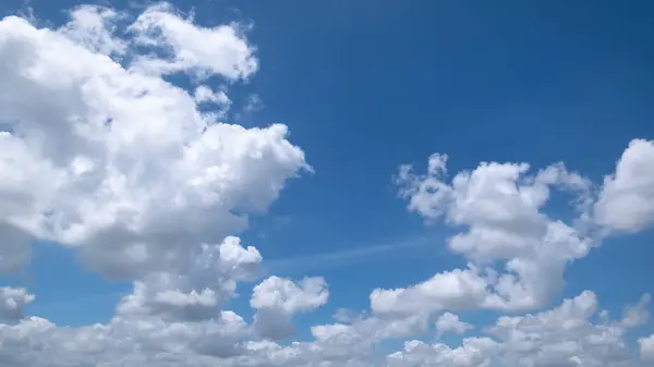 stock image clear blue sky background,clouds with background, Blue sky background with tiny clouds. White fluffy clouds in the blue sky. 