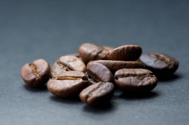 coffee in white cup and coffee beans are the background. clipart