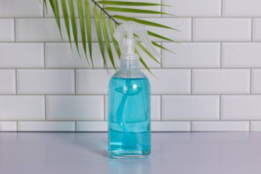 Glass spray bottle in the kitchen. Cleaning concept