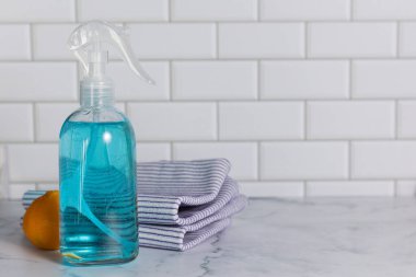 Glass spray bottle in the kitchen. Cleaning concept