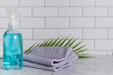 Glass spray bottle in the kitchen. Cleaning concept