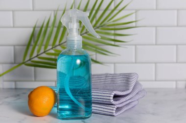Glass spray bottle in the kitchen. Cleaning concept