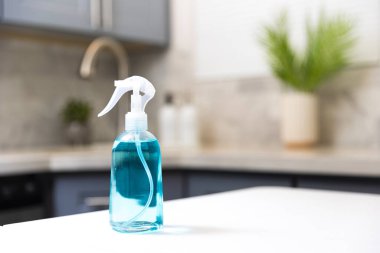 Cleaning  spray in a kitchen