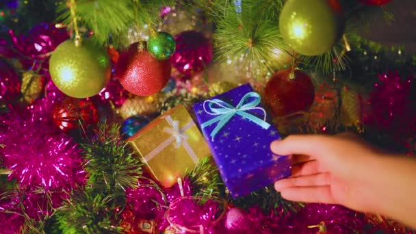 Unrecognizable Hand Puts Blue Box Gift Next Yellow One Lie — Stock Video