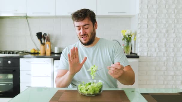 Young Man Holds Fork Salad One Hand Other Shows Stop — Stock Video