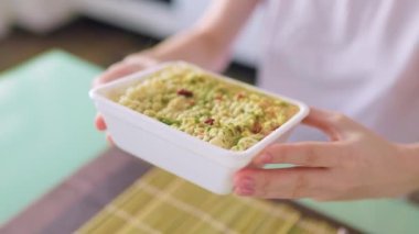 In this fast-paced world, the convenience of instant noodles is shown as they are quickly prepared for a supper of junk food.