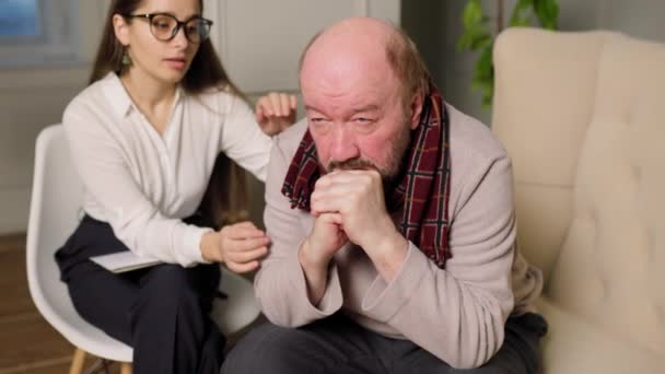 Aged Bald Man Session Psychologist Doctor Listens Writes Help Depression — стоковое видео