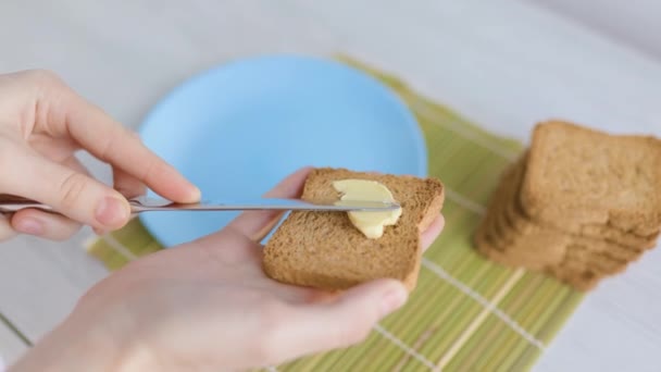 Close Hands Spreading Butter Slice Toasted Bread Symbolizing Healthy Delicious — Vídeos de Stock