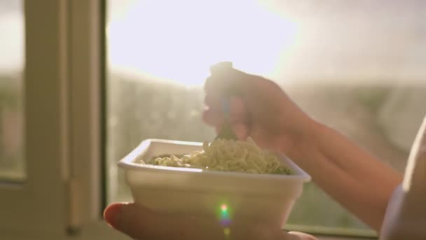 Image Hand Quickly Enjoying Unhealthy Meal Instant Noodles Home Window — Stock Video
