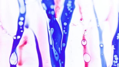 Liquid paint mixing backdrop with splash and swirl. Detailed background motion with brown, selective focus, defocused,