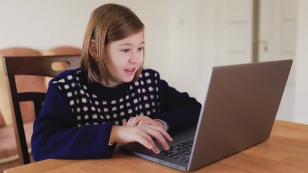 Excited Young Gamer Kid Playing Her Laptop Home Completely Immersed — Stockvideo