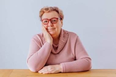 At Home with an Overweight Senior Woman, A pretty elderly woman at home, captured in a striking portrait that celebrates her unique beauty and individuality.