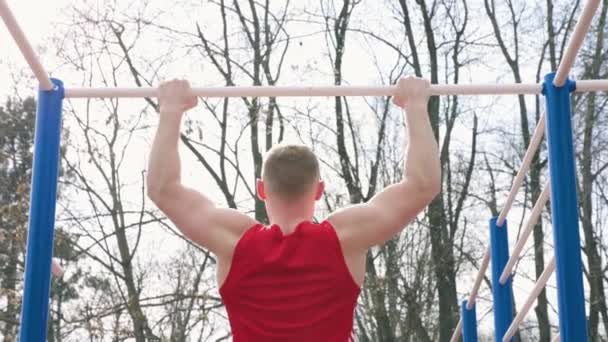 Sweat Endurance Active Guy Doing Pull Ups Outdoor Gym Gars — Video