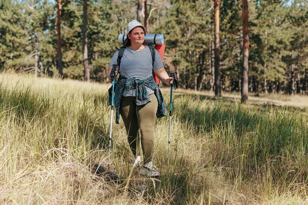 stock image into the world of freedom and self discovery with the healthy lifestyle chronicles of an overweight female hiker. Follow her solo trek through nature, showcasing the empowering strides of a woman