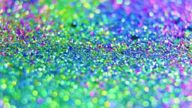 Özlü bir videoda büyüyü keşfetmek, lüks ve soyut bir döngü arka planına göz atmak. Güzel bokeh ve seçici odak, turkuaz, turuncu ve sarı renkli dokuların güzelliğini gözler önüne seriyor..