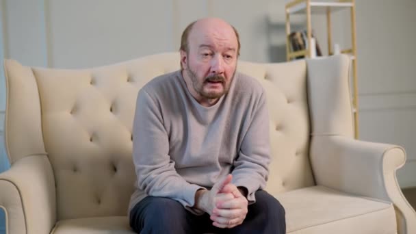 Aged Man Sad Look Sits Sofa Looks Somewhere Distance Alzheimer — Stock Video