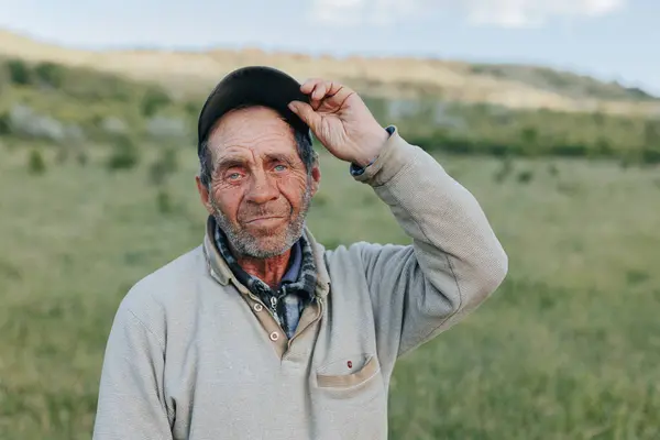 stock image portrait the resilience and dignity of a senior peasant man farmer, his weathered features and steadfast demeanor a testament to the enduring bond between man and nature in the rural landscape