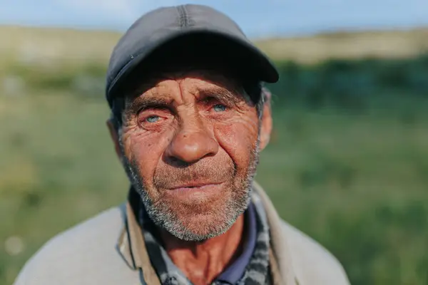 stock image This portrait of an elderly worker shepherd farmer portrays the quiet resolve of a man who has spent his life in harmony with the land, reflecting a deep connection to the natural world.