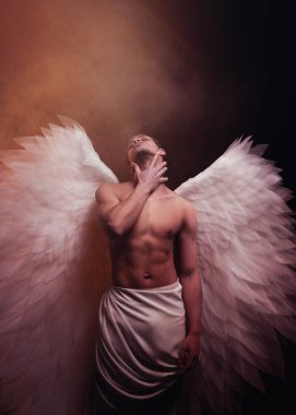 Young strong angel with white wings from heaven. Angel with muscular body. Sensual man clipart