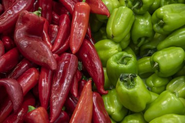Background with fresh red and green peppers waiting to make a fine meal. Top view, flat lay, close-up clipart