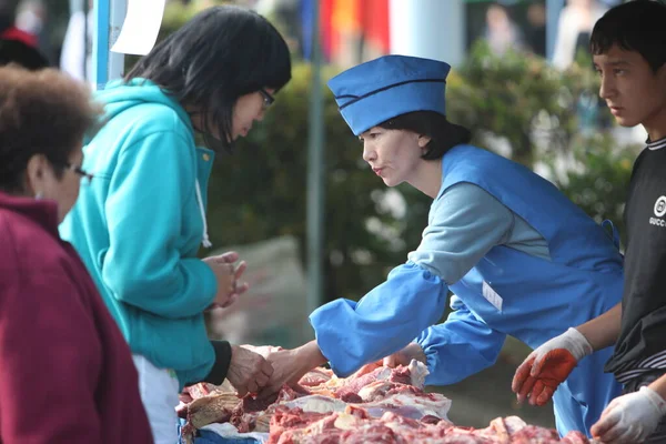 Stock image People buy food at a food fair in downtown Almaty in Kazakhstan. September 25, 2010